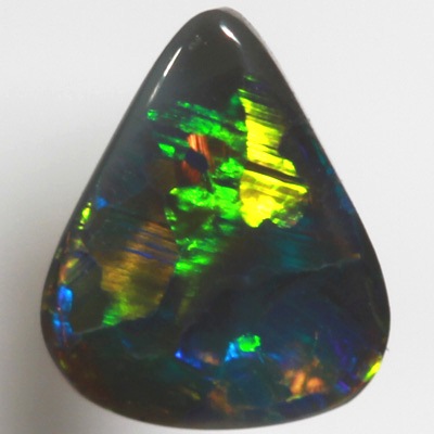 SOLID BLACK OPAL Bright rolling flashes of neon orange and neon green